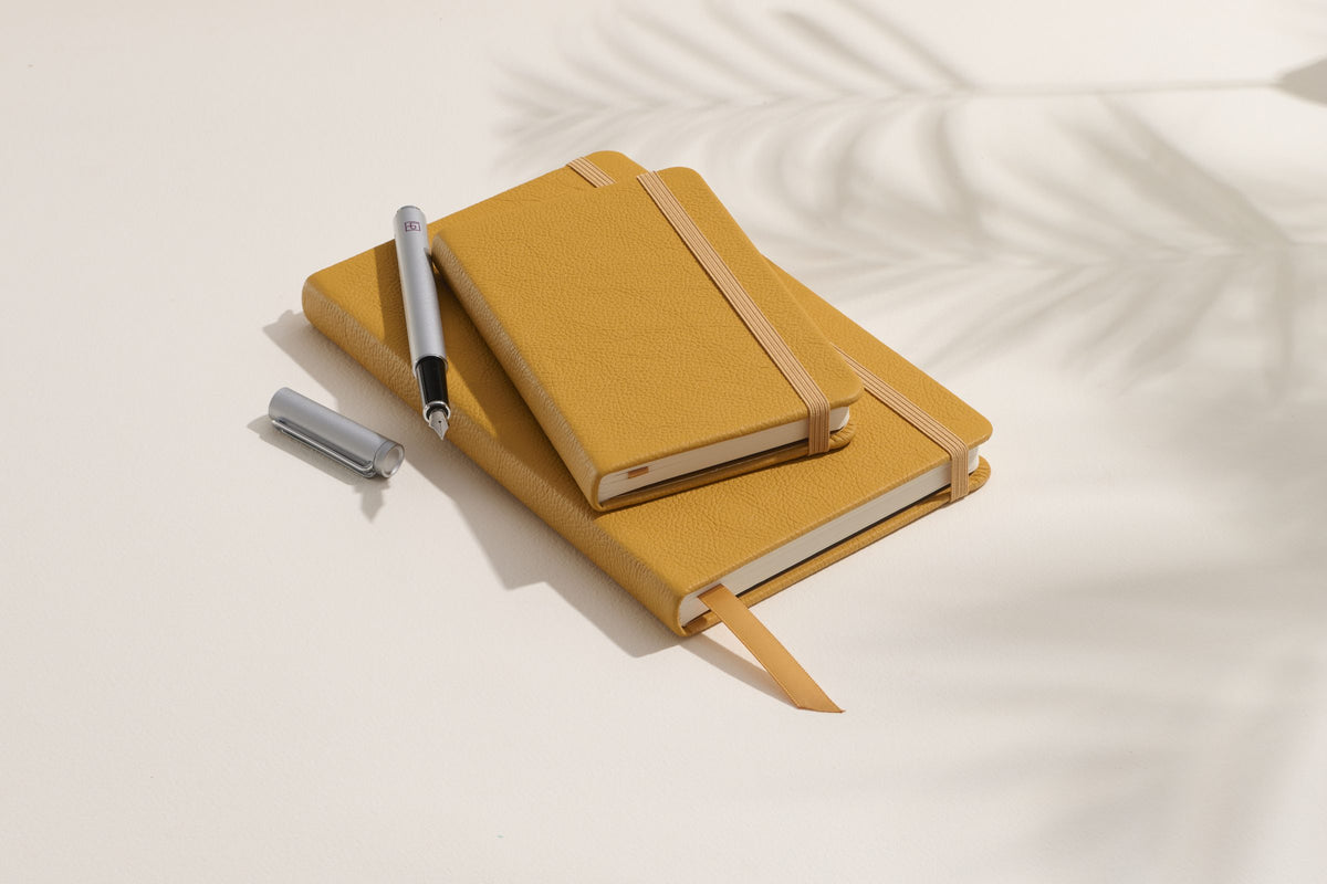 Butter Yellow Inspire notebooks, pocket and large, with a pen