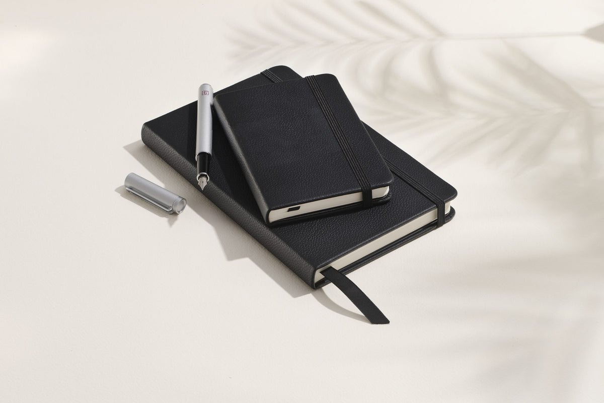 Midnight Black Inspire notebooks, pocket and large, with a pen