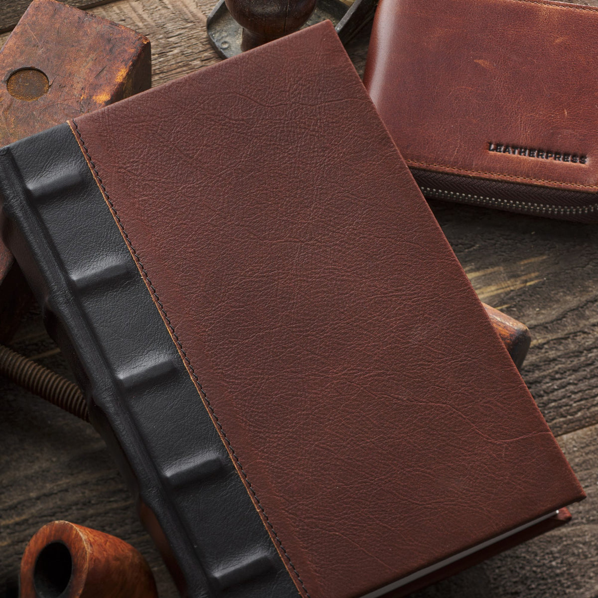 The Saddler Quintessential journal in burgundy full-grain leather with a ribbed spine