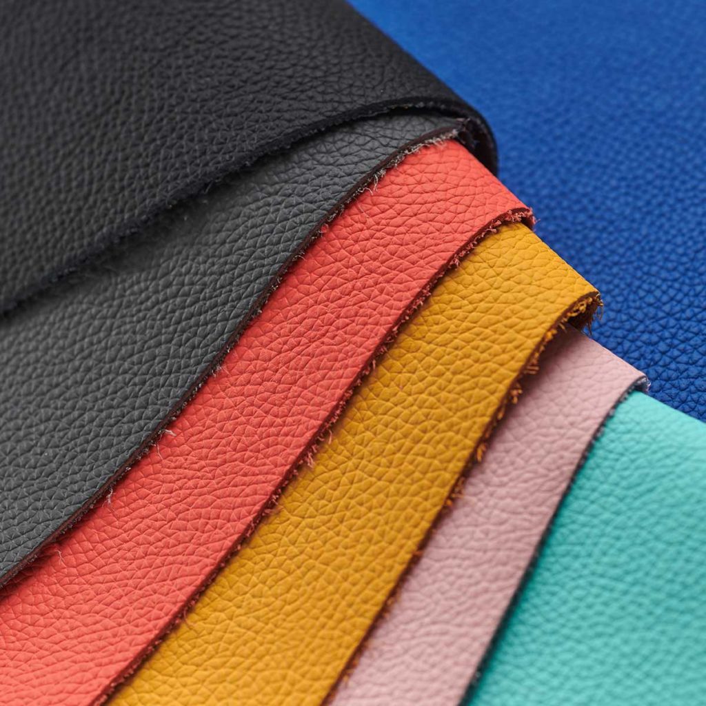 The seven colorful swatches of Inspire collection leather notebooks