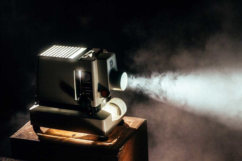 LIght shining out of a retro film projector